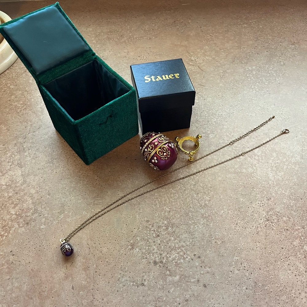 Stauer Enamel Egg and Matching Pendant Necklace with stand, box and gift box.